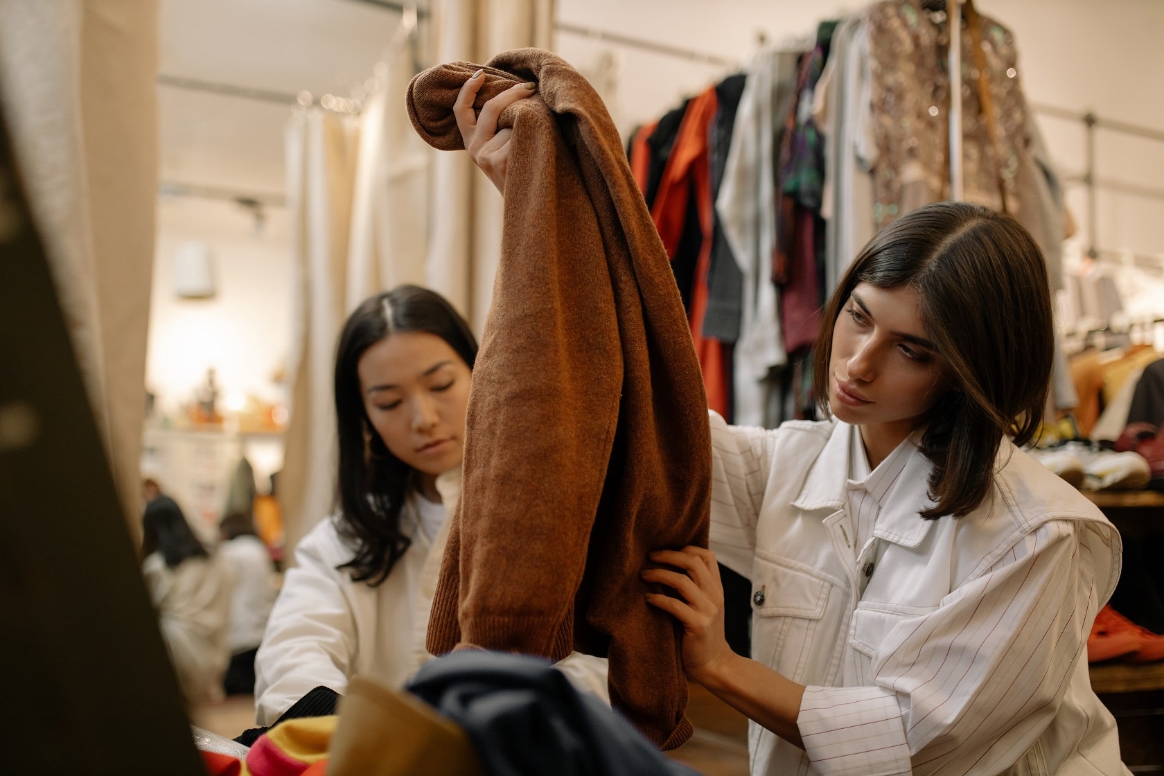 Two women looking at the jacket